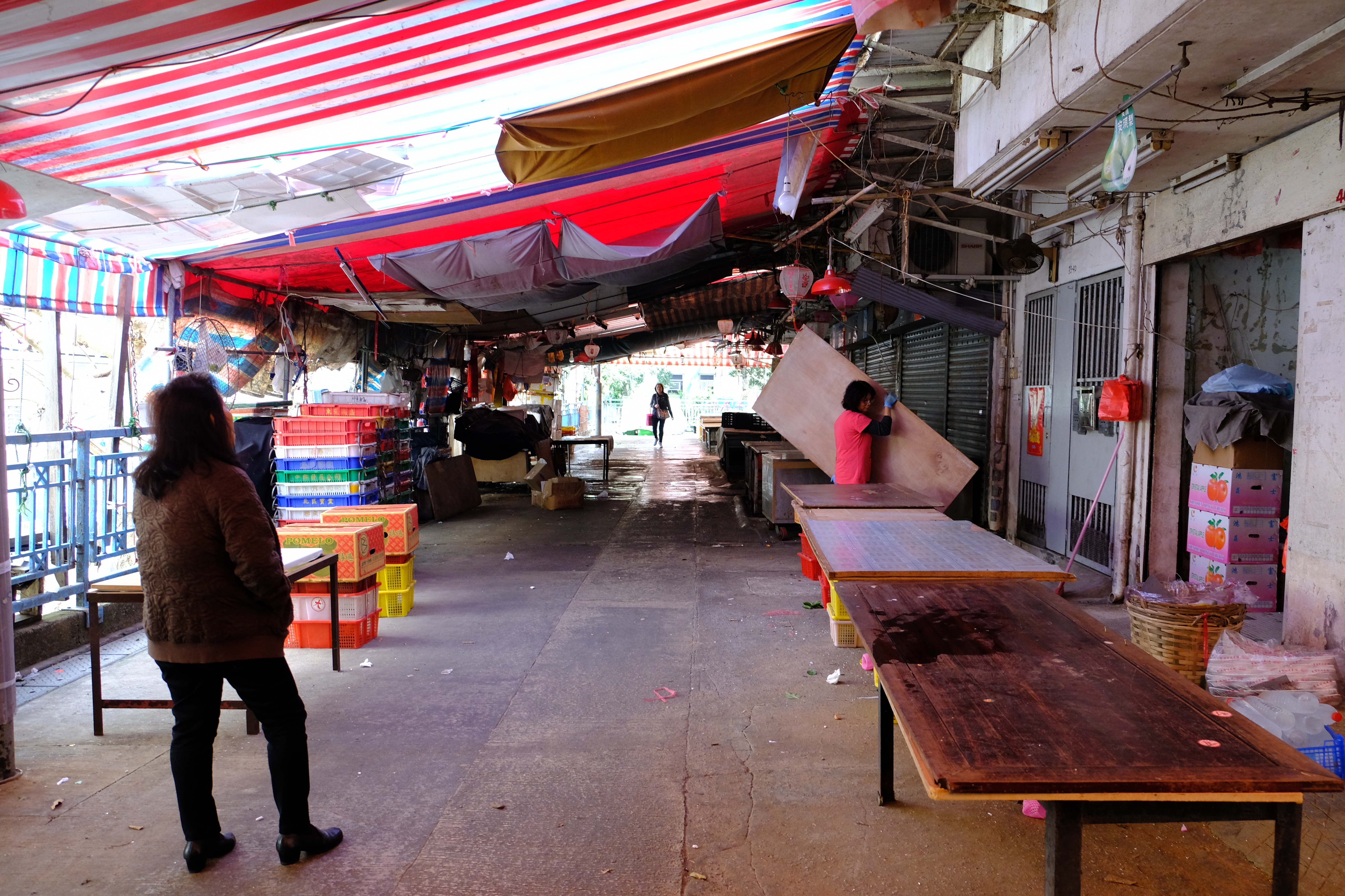 The resident and the shop owner in the market.