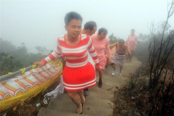 Men in Guang Dong celebrating International Women's Day 2016. Image from newsgd.