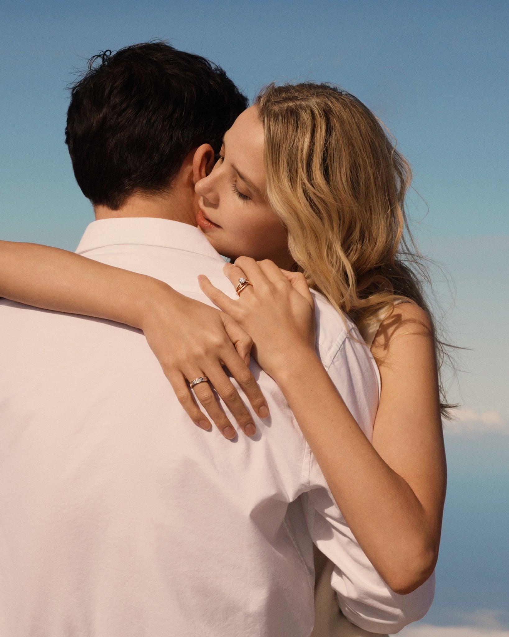 woman-wearing-diamond-ring-hugging-man